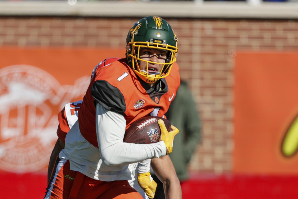 National Team wide receiver Christian Watson, of North Dakota State, returns a punt during the first half of an NCAA Senior Bowl college football game, Saturday, Feb. 5, 2022, in Mobile, Ala. (AP Photo/Butch Dill)