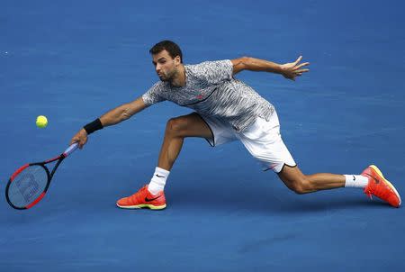 Tennis - Australian Open - Melbourne Park, Melbourne, Australia - 23/1/17 Bulgaria's Grigor Dimitrov stretches for a shot during his Men's singles fourth round match against Uzbekistan's Denis Istomin. REUTERS/Thomas Peter