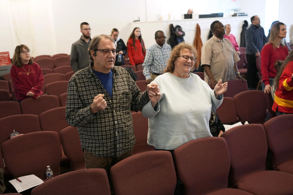 Congregation members pray during service at the First Church of God, Sunday, Jan. 7, 2024, in Des Moines, Iowa. Former President Donald Trump and his rivals for the GOP nomination have pushed for endorsements from pastors and faith communities. Evangelicals and religious Christian groups are traditionally critical to the Republican caucuses. (AP Photo/Charlie Neibergall)