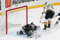 Los Angeles Kings goaltender Calvin Petersen, left, is scored on by Vegas Golden Knights right wing Mark Stone during the second period of an NHL hockey game Monday, April 12, 2021, in Los Angeles. (AP Photo/Mark J. Terrill)