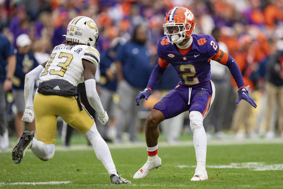 Clemson cornerback Nate Wiggins (2) defends against Georgia Tech wide receiver Eric Singleton Jr. (13) during the second half of an NCAA college football game Saturday, Nov. 11, 2023, in Clemson, S.C. (AP Photo/Jacob Kupferman)