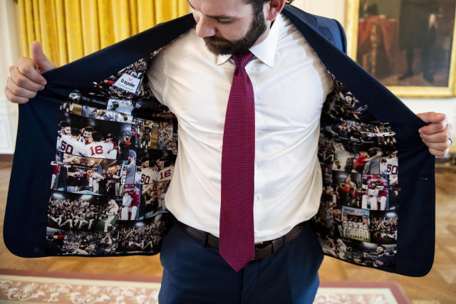 President Donald Trump receives a jersey with his name from Boston Red Sox J.D.  Martinez, Right Fielder, right, as he welcomes the 2018 World Series  Champions to the White House, The Boston