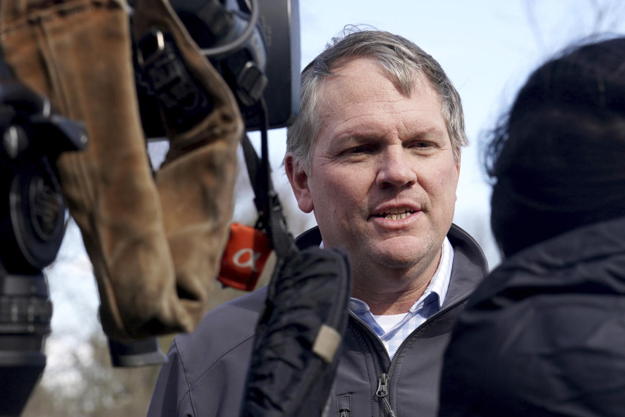 Norfolk Southern President and CEO Alan Shaw speaks to reporters, Tuesday, Feb. 21, 2023, near the site where a freight train derailed Feb. 3 in East Palestine, Ohio, (AP Photo/Matt Freed)