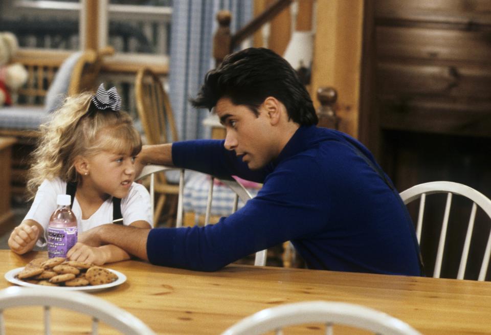 jodie and john talking at the diner table in a scene