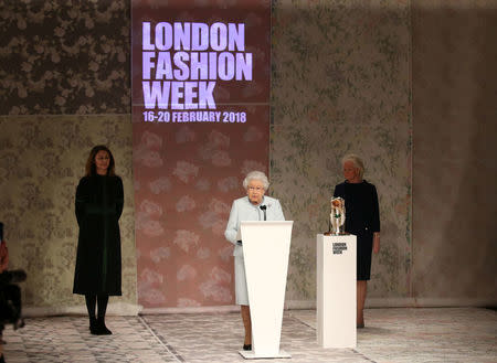 Britain's Queen Elizabeth II makes a speech before presenting the inaugural Queen Elizabeth II Award for British Design to Richard Quinn after his show at London Fashion Week, in London, Britain February 20, 2018. REUTERS/Paul Hackett