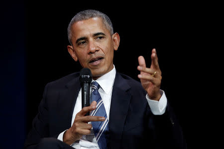 Former U.S. president Barack Obama speaks at a conference during his first visit to France since he left the White House, Paris, France December 2, 2017. The session, organized by an association called "Les Napoleons" is hosted by Orange CEO Stephane Richard. REUTERS/Benoit Tessier