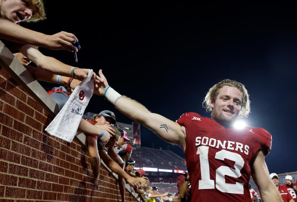 OU receiver Drake Stoops (12) greets fans after the Sooners' win against SMU on Sept. 9 at Gaylord Family-Oklahoma Memorial Stadium in Norman.