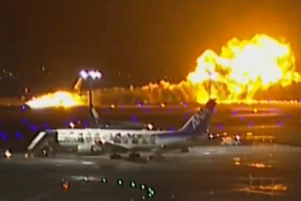 Footage appeared to show the moment the plane caught fire (AP)