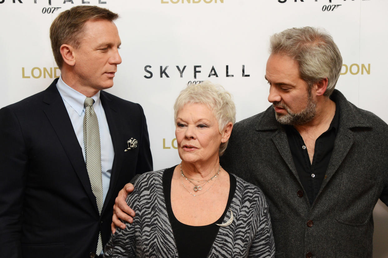 LONDON, ENGLAND - OCTOBER 22: (L-R) Daniel Craig, Judi Dench and Sam Mendes pose at a photocall for the new James Bond film 'Skyfall' at The Dorchester Hotel on October 22, 2012 in London, England. (Photo by Dave J Hogan/Getty Images)