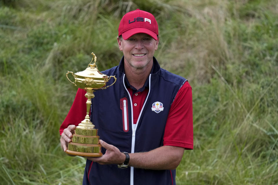 Team USA captain Steve Stricker poses with the trophy after the Ryder Cup matches at the Whistling Straits Golf Course Sunday, Sept. 26, 2021, in Sheboygan, Wis. (AP Photo/Ashley Landis)