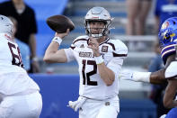 Missouri State quarterback Jacob Clark looks to pass during the first half of an NCAA college football game against Kansas Friday, Sept. 1, 2023, in Lawrence, Kan. (AP Photo/Charlie Riedel)