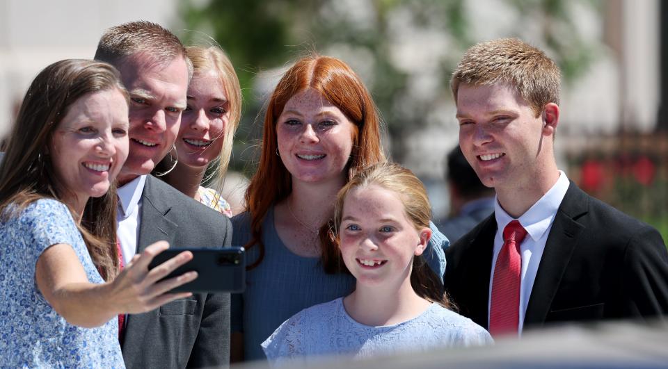 The Clifton family takes a photos outside the temple following the first session of the dedication of the Saratoga Springs Utah Temple in Saratoga Springs, Utah, on Sunday, Aug. 13, 2023. | Scott G Winterton, Deseret News
