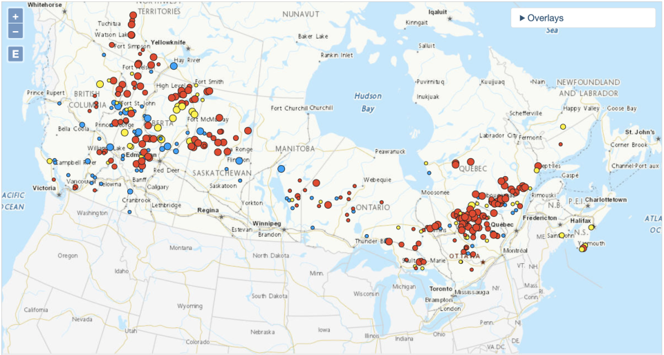 A map on Natural Resources Canada shows the extent of wildfires on Wednesday. The Northeast United States is overcast with smoke from the fires. This map contains information licensed under the Open Government Licence, Canada. The red spots show fires out of control. The yellow spots show fires being held in position.