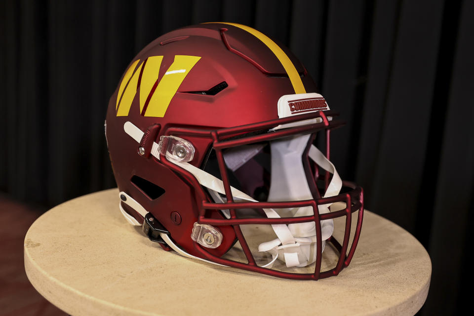 Mar 17, 2022; Ashburn, VA, USA;  The helmet of Washington Commanders quarterback Carson Wentz sits on display for his introductory press conference at Inova Sports Performance Center Auditorium. Mandatory Credit: John McCreary-USA TODAY Sports