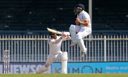 Cricket - Pakistan v England - Third Test - Sharjah Cricket Stadium, United Arab Emirates - 4/11/15 Pakistan's Mohammad Hafeez in action with England's James Taylor (R) Action Images via Reuters / Jason O'Brien Livepic