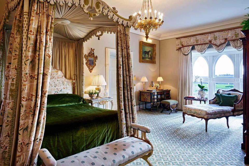 A guest room with a canopy bed at Ashford Castle