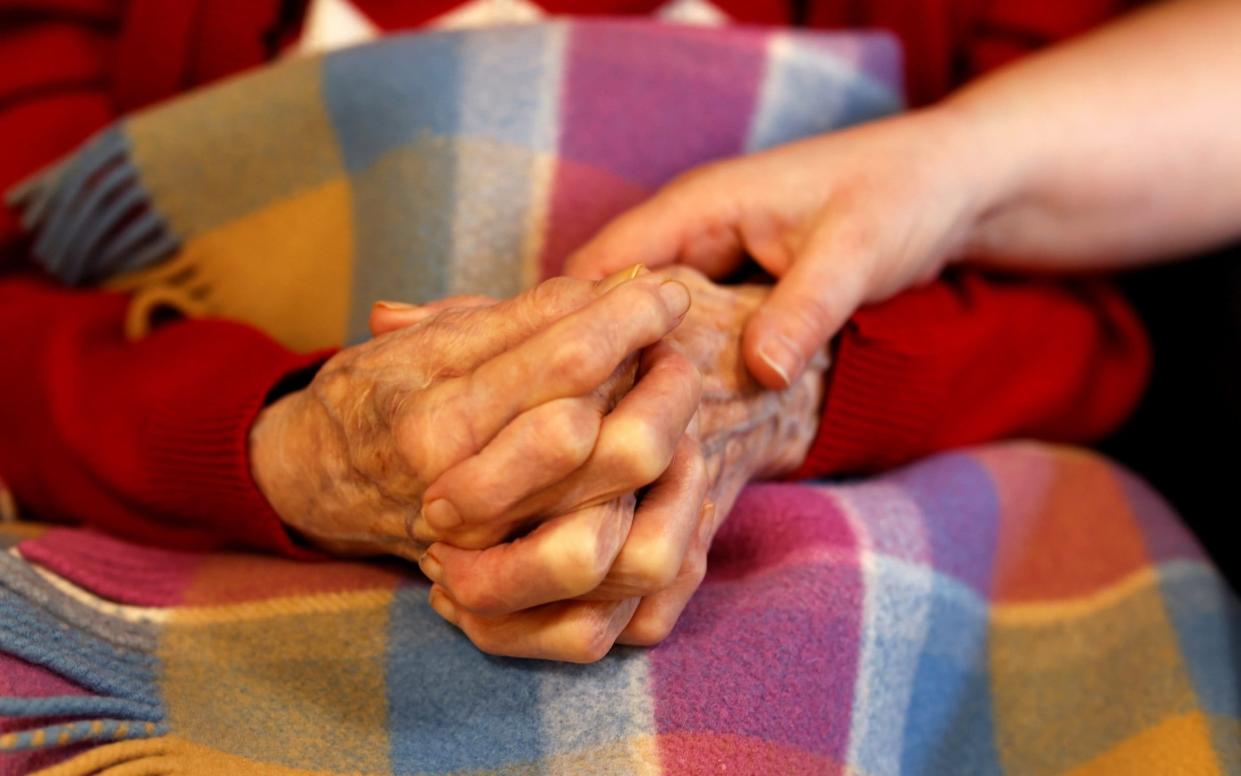 Holding hands - More than 5,000 needless dementia and Alzheimer's deaths since March, ONS data shows - REUTERS