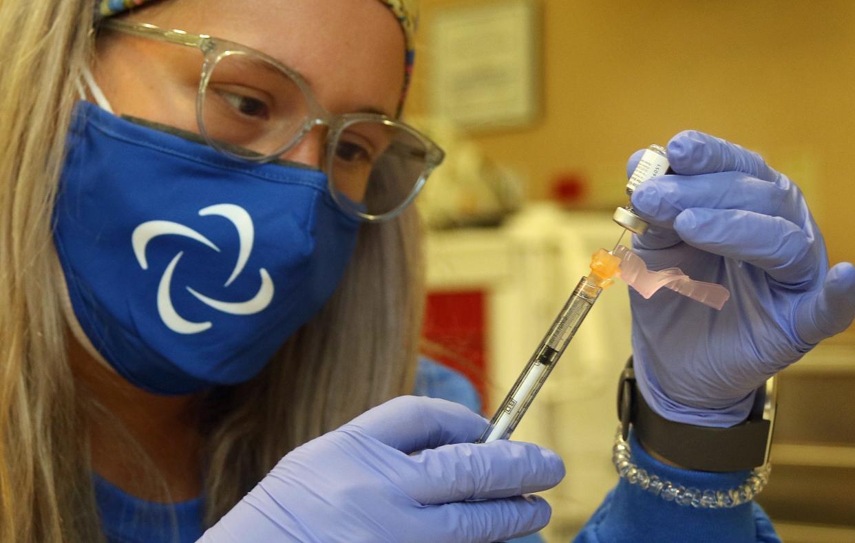 In this file photo, Pharmacy Technician Mollie Sidebottom fills a syringe with COVID-19 vaccine as CaroMont Health hosted a  COVID-19 vaccination event for teachers at CaroMont Regional Medical Center in Gastonia.