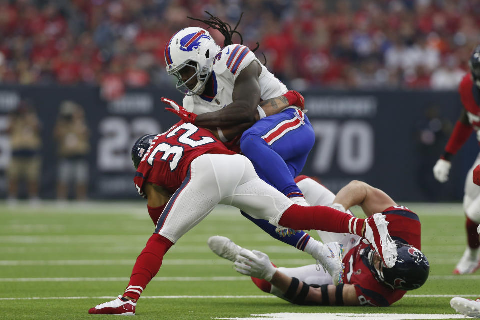 Chris Ivory nearly got past Jadeveon Clowney on Sunday afternoon in Houston. There was just one problem: His hair was too long. (Getty Images)