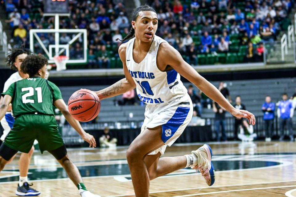 Grand Rapids Catholic Central's Durral Brooks moves the ball against Williamston during the second quarter in the Division 2 state final on Saturday, March 26, 2022, at the Breslin Center in East Lansing.