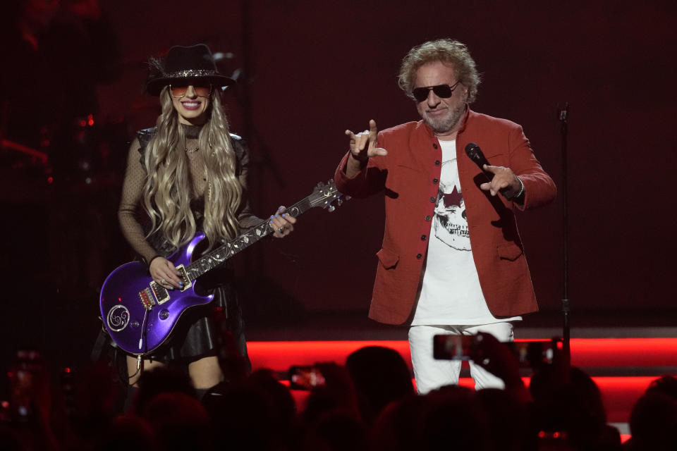 Orianthi, left, and Sammy Hagar perform during MusiCares Person of the Year honoring Jon Bon Jovi on Friday, Feb. 2, 2024, in Los Angeles. (AP Photo/Chris Pizzello)