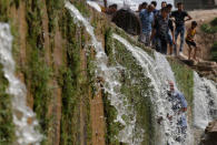 Iraqi families and youths enjoy their Friday holiday at Shallalat district (Arabic for "waterfalls") in eastern Mosul, Iraq, April 21, 2017. REUTERS/ Muhammad Hamed