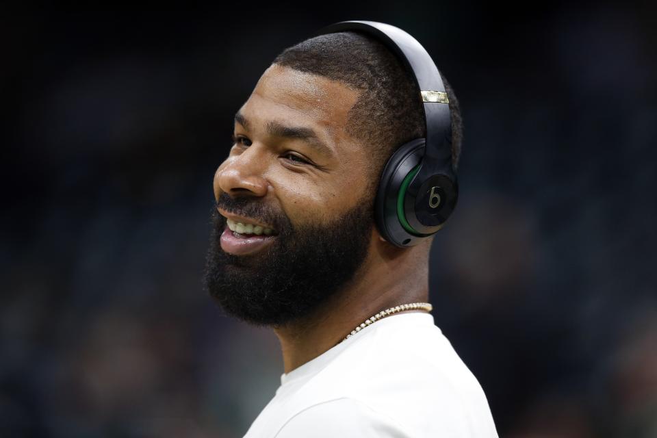 Boston Celtics' Marcus Morris wears headphones during warmups before Game 3 of a second round NBA basketball playoff series against the Milwaukee Bucks in Boston, Friday, May 3, 2019. (AP Photo/Michael Dwyer)