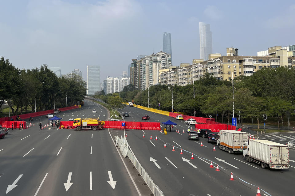 Barriers form a security checkpoint in the Haizhu district in Guangzhou in southern China's Guangdong province Friday, Nov. 11, 2022. As the country reported 10,729 new COVID cases on Friday, more than 5 million people were under lockdown in the southern manufacturing hub Guangzhou and the western megacity Chongqing. (AP Photo)