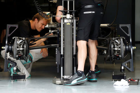 Formula One - F1 - Malaysia Grand Prix - Sepang, Malaysia- 29/9/16 Mercedes' Nico Rosberg of Germany inspects his car. REUTERS/Edgar Su