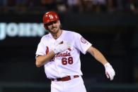 Aug 31, 2018; St. Louis, MO, USA; St. Louis Cardinals starting pitcher Austin Gomber (68) celebrates after hitting a two run double during the second inning against the Cincinnati Reds at Busch Stadium. Mandatory Credit: Jeff Curry-USA TODAY Sports