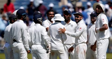 Cricket - India v Australia - First Test cricket match - Maharashtra Cricket Association Stadium, Pune, India - 23/02/17. India's players celebrate the wicket of Australia's captain Steve Smith. REUTERS/Danish Siddiqui