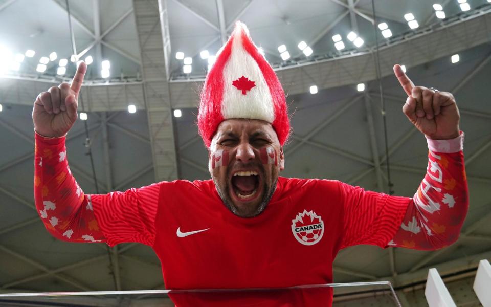 A Canada fan cheers ahead of a group F World Cup soccer match against Morocco at the Al Thumama Stadium in Doha - Nathan Denette/AP