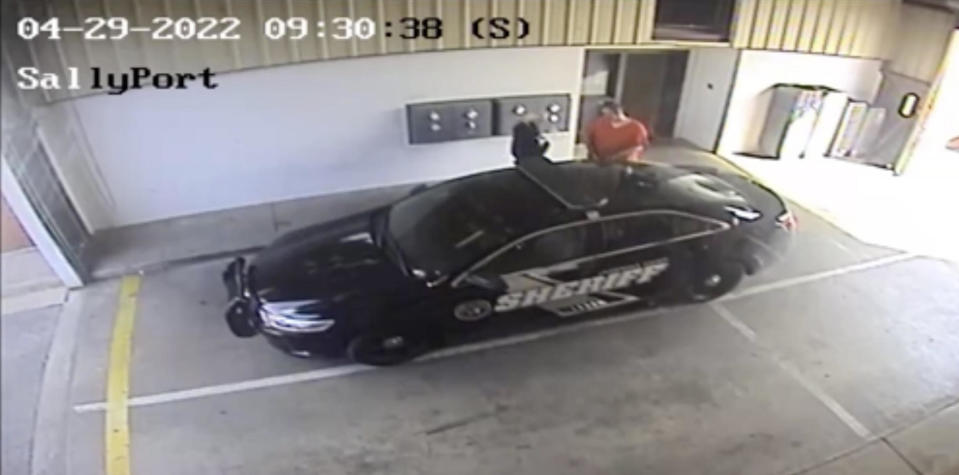 Surveillance video released by the Lauderdale County Sheriff's Office shows inmate Casey White getting into a squad car with corrections officer Vicky White as they left the jail on April 29, 2022. / Credit: Lauderdale County Sheriff's Office