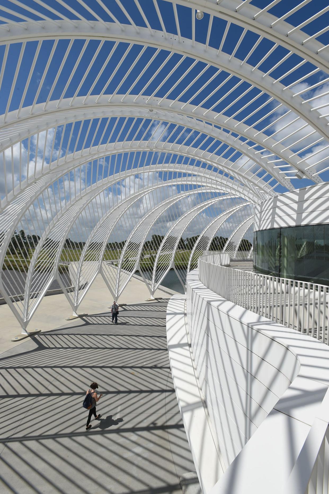 A student walks into the Innovation, Science and Technology building at Florida Polytechnic University in Lakeland.