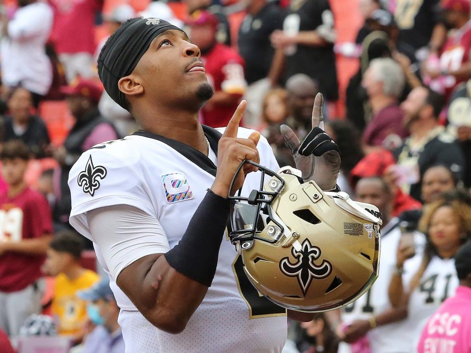 Jameis Winston points to the sky before a game against the Washington Football Team.