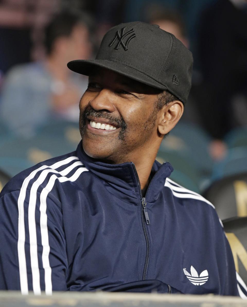 Actor Denzel Washington watches a preliminary bout before the main event between Floyd Mayweather Jr. and Manny Pacquiao, on Saturday, May 2, 2015 in Las Vegas. (AP Photo/Isaac Brekken)