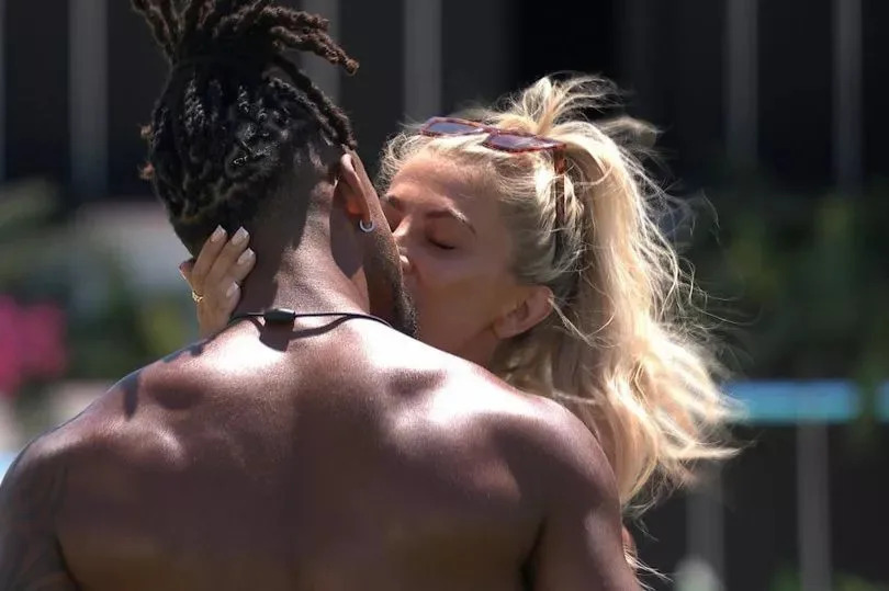 Konnor Ewudzi and Lolly Hart kissing