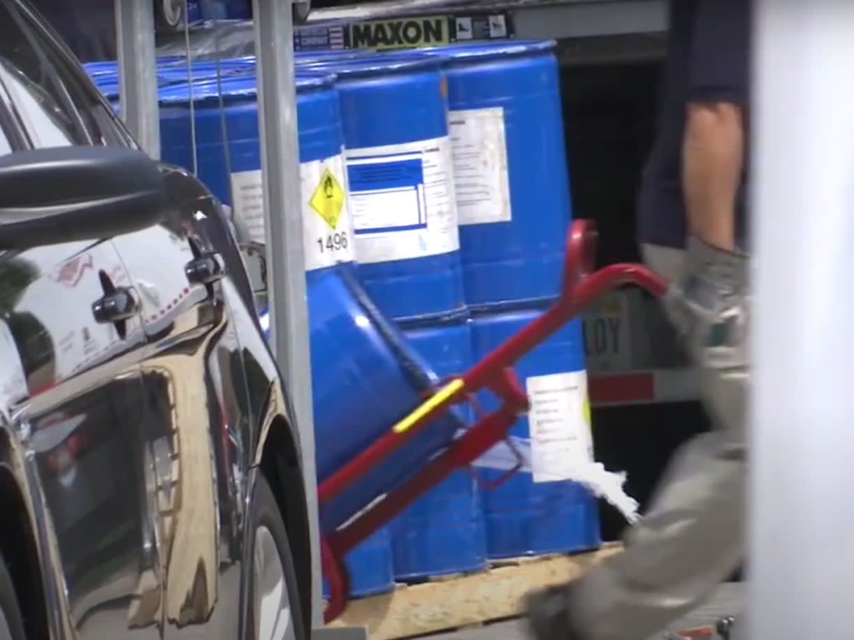 <p>Video of federal investigators taking blue barrels from the Grenon family in Florida in July 2020</p> (FOX 13 Tampa Bay)