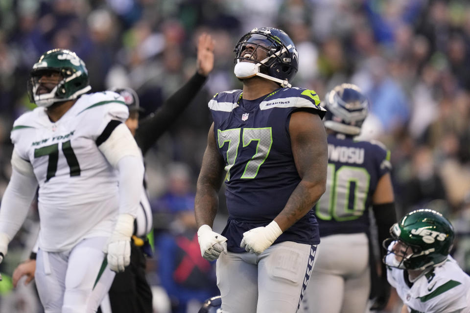 Seattle Seahawks defensive tackle Quinton Jefferson (77) celebrates his sack against the New York Jets during the second half of an NFL football game, Sunday, Jan. 1, 2023, in Seattle. (AP Photo/Godofredo A. Vásquez)