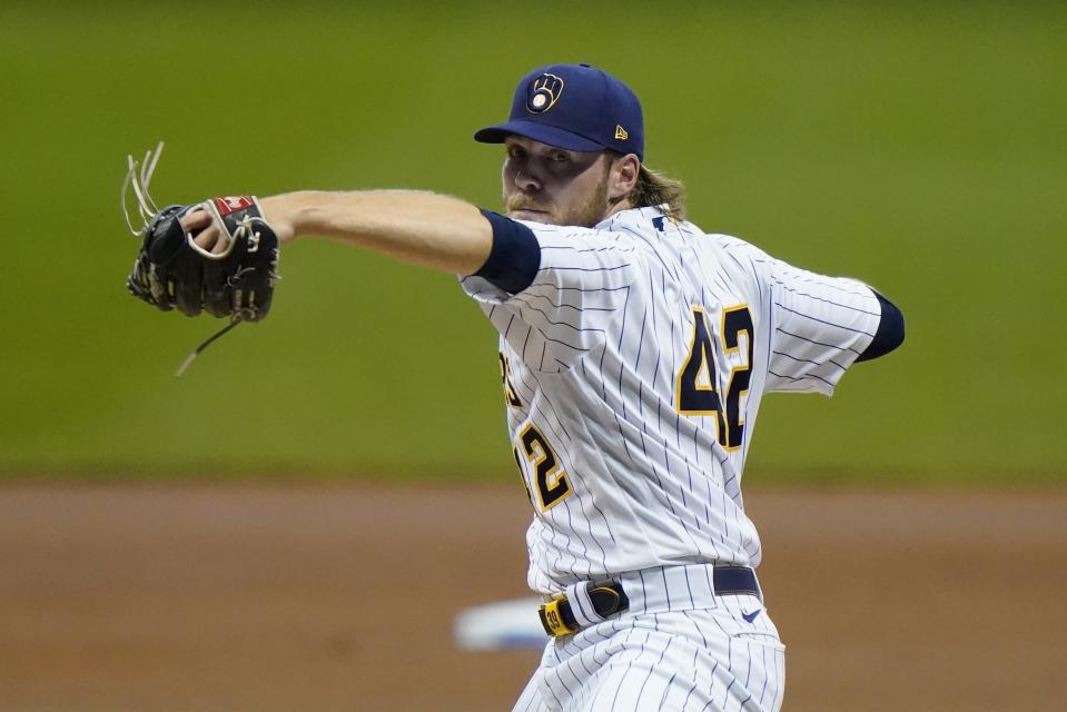 Milwaukee Brewers starting pitcher Corbin Burnes throws during the first inning of a baseball game against the Pittsburgh Pirates Friday, Aug. 28, 2020, in Milwaukee. (AP Photo/Morry Gash)