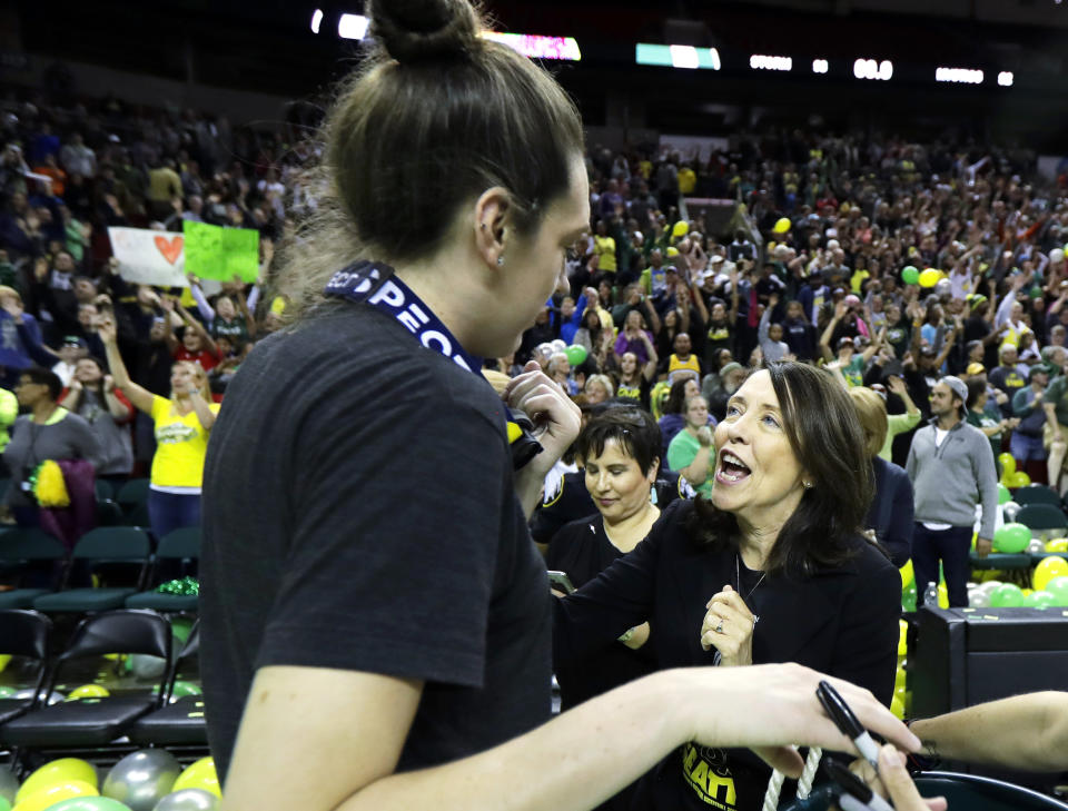 In this photo taken Sunday, Sept. 16 2018, Sen. Maria Cantwell, D-Wash., right, greets Seattle Storm forward Breanna Stewart, left, during a fan rally in Seattle to celebrate the Storm winning the 2018 WNBA basketball championship. Cantwell has easily won re-election to the U.S. Senate in previous years, but as she seeks her fourth-term this November, she is facing her most recognizable opponent -- Republican Susan Hutchison, who spent two decades as a Seattle TV news anchor before leading the state Republican party for five years. (AP Photo/Ted S. Warren)