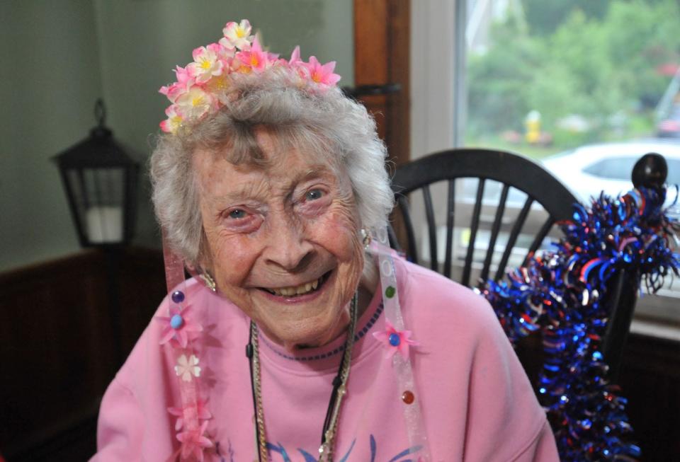 Lillie Durgan is all smiles as she celebrates her 100th birthday during a party in her neighbor's home in Rockland, Saturday, July 3, 2021. Tom Gorman/For The Patriot Ledger