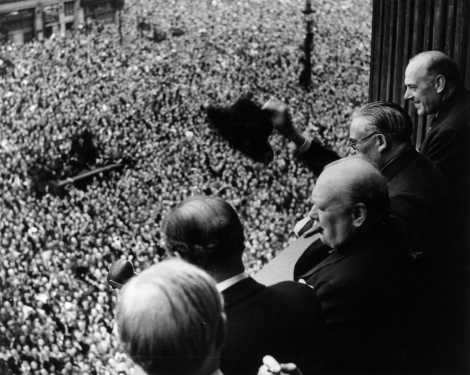 British Prime Minister Winston Churchill (1874 - 1965) waving to crowds gathered in Whitehall on VE Day, 8th May 1945. (Photo by Keystone/Hulton Archive/Getty Images)