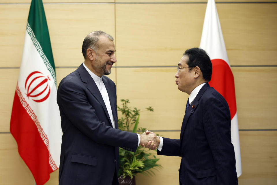 Iranian Foreign Minister Hossein Amir-Abdollahian, left, meets with Japanese Prime Minister Fumio Kishida at Kishida's office in Tokyo Monday, Aug. 7, 2023. (Issei Kato/Pool Photo via AP)