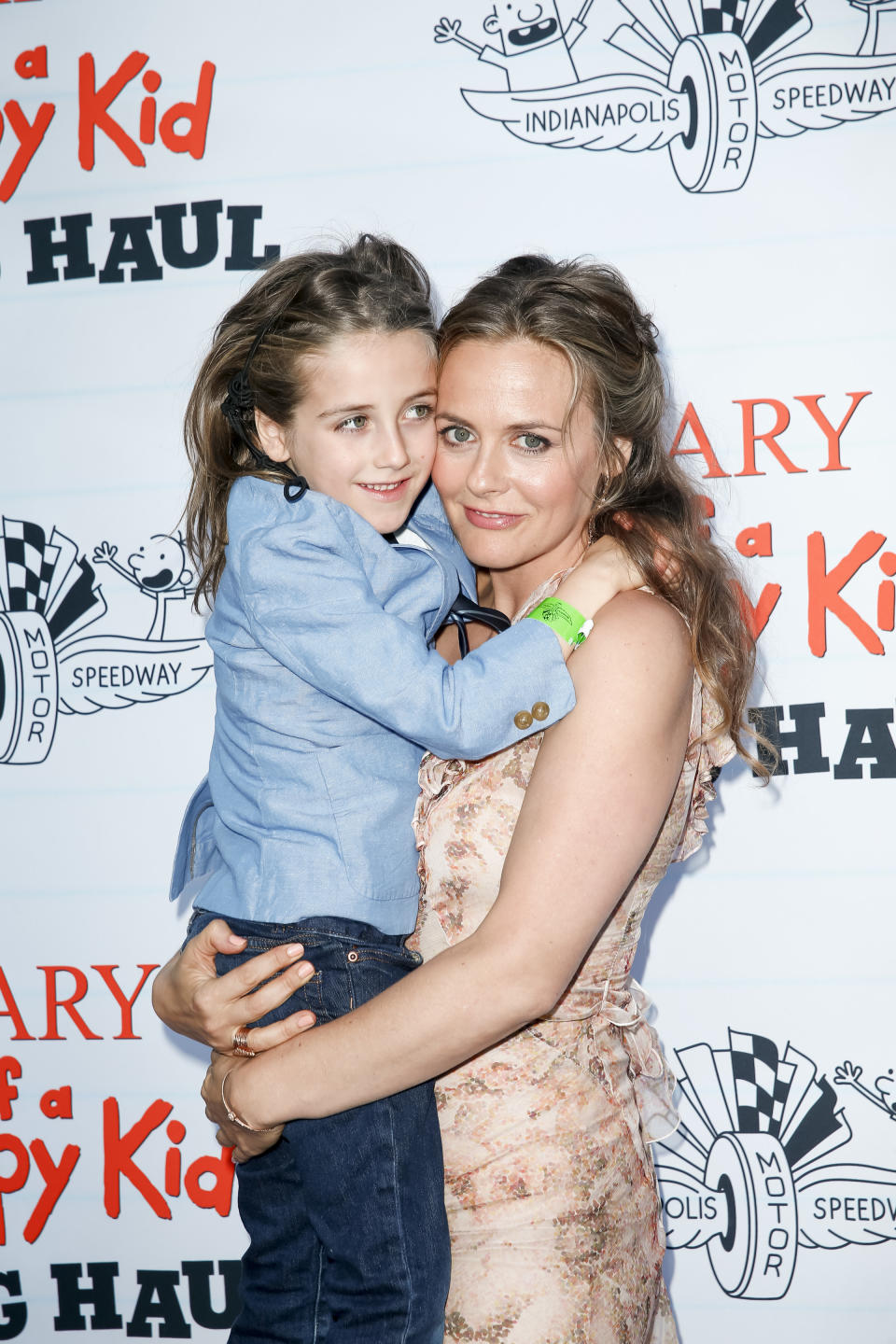 Alicia Silverstone holding her son Bear Blu Jarecki at the premiere of Diary of a Wimpy Kid 