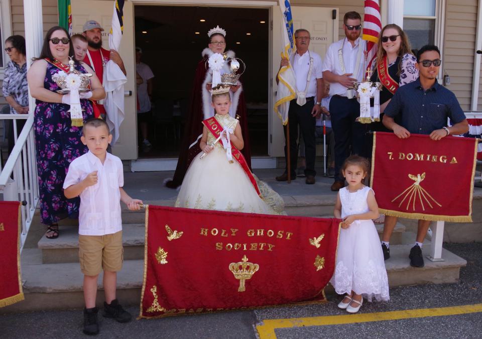 Queen Kelly Terrasi and granddaughter Mia Fay, 6, both from Taunton, take center stage for the last time in front of friends and family before going inside and taking part in the traditional feast sopas on Sunday, July 10, 2022.