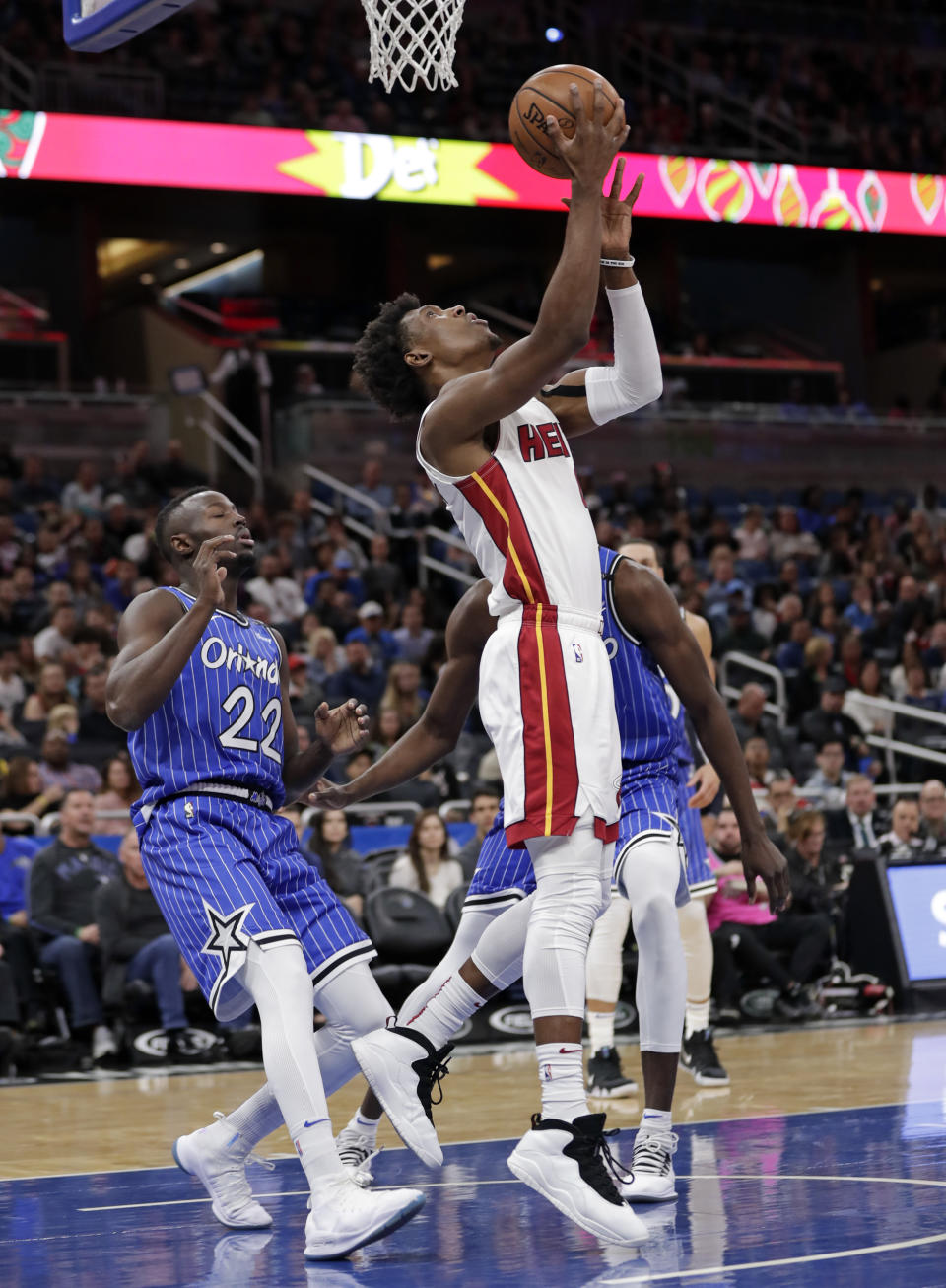Miami Heat's Josh Richardson, front right, takes a shot in front of Orlando Magic's Jerian Grant (22) during the first half of an NBA basketball game, Sunday, Dec. 23, 2018, in Orlando, Fla. (AP Photo/John Raoux)