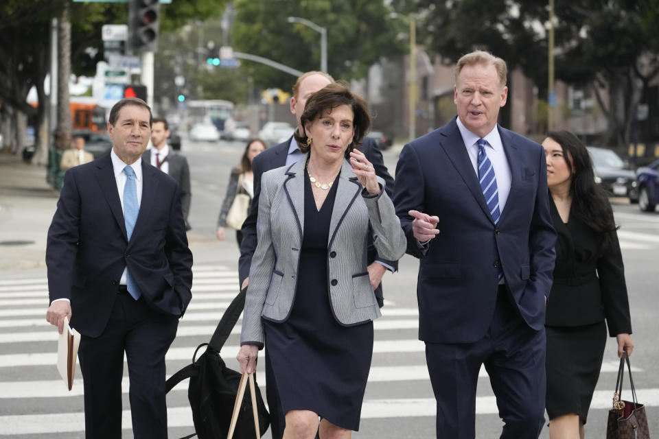 NFL Commissioner Roger Goodell, right, arrives at federal court Monday, June 17, 2024, in Los Angeles. Goodell is expected to testify as a class-action lawsuit filed by "Sunday Ticket" subscribers claiming the NFL broke antitrust laws. (AP Photo/Damian Dovarganes)