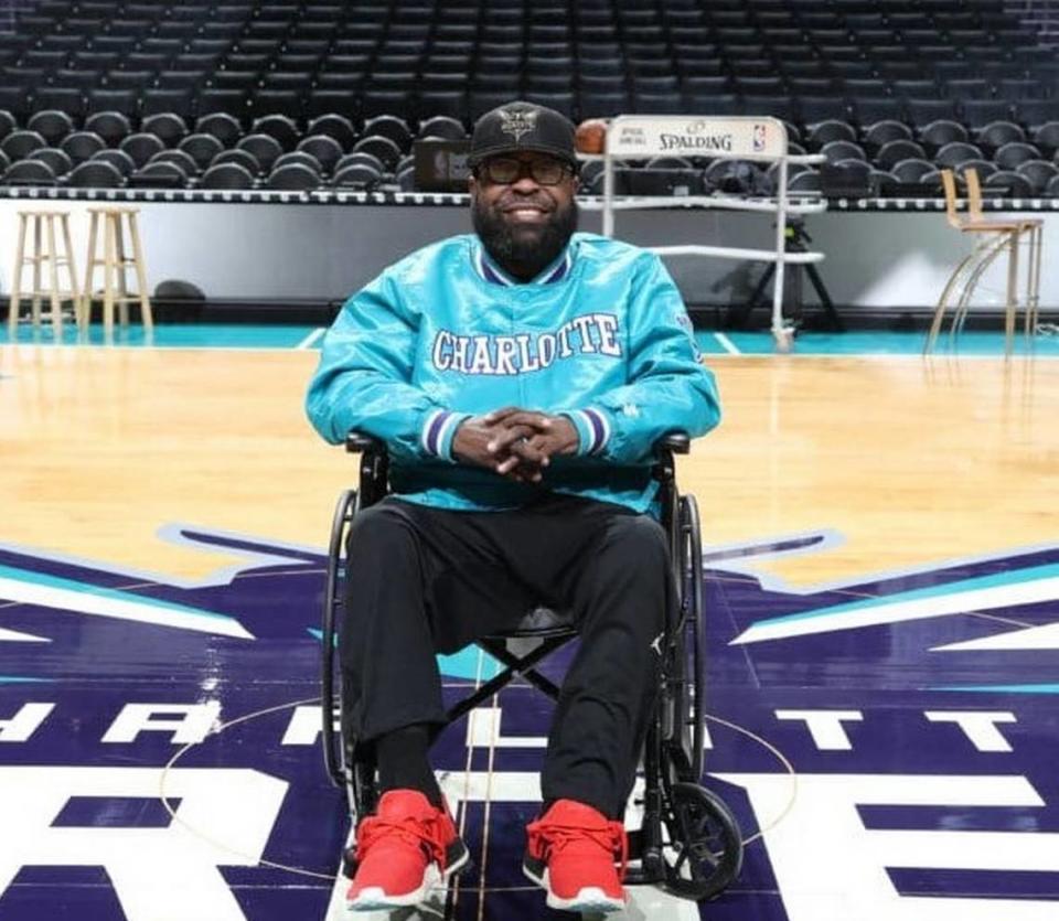 In 2018, Hornets PA announcer Patrick “Big Pat” Doughty posed at center court for a photo. Doughty, who has kidney disease and neuropathy, says he is on the list for a potential kidney transplant.