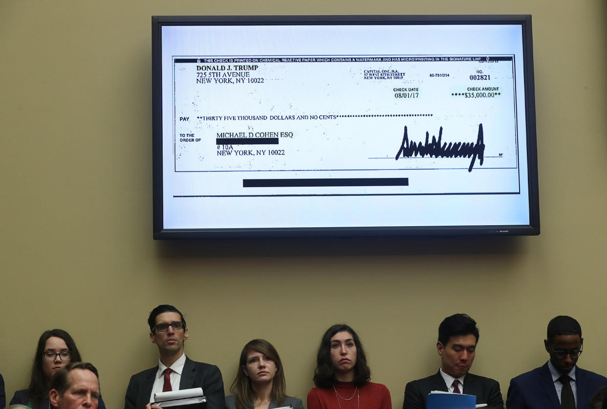 A $35,000 check signed by President Trump to Michael Cohen, his former personal attorney, is shown on a television monitor inside the hearing room as Cohen testifies on Capitol Hill in Washington, D.C., Feb. 27, 2019. (Jonathan Ernst/Reuters)